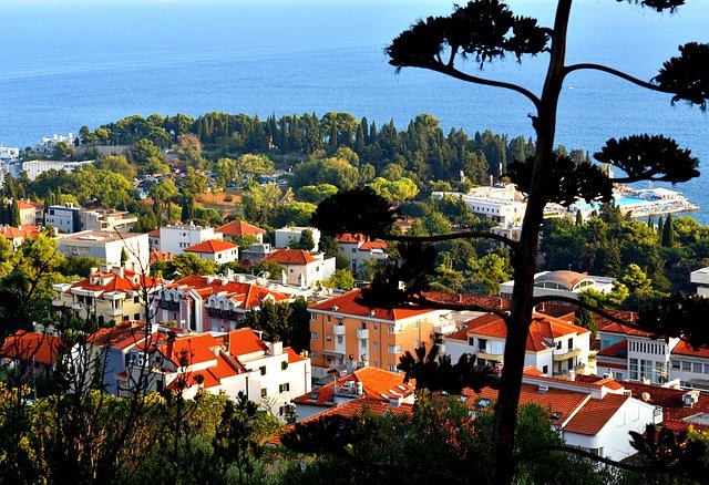 Croatian coastal town with terracotta roofs on a multi-centre holiday
