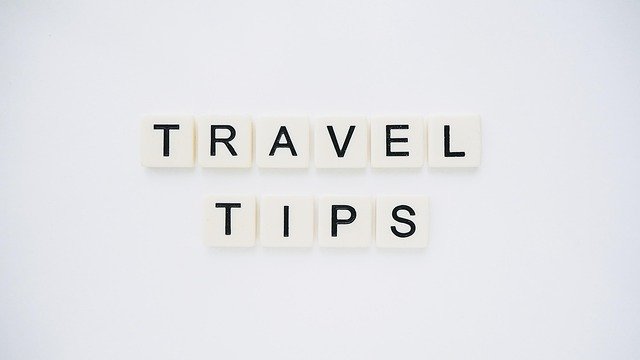 Traveller planning a coach and ferry route from England to Ireland with a map