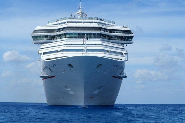 Festively decorated cruise ship lounge with Christmas lights and holiday dining