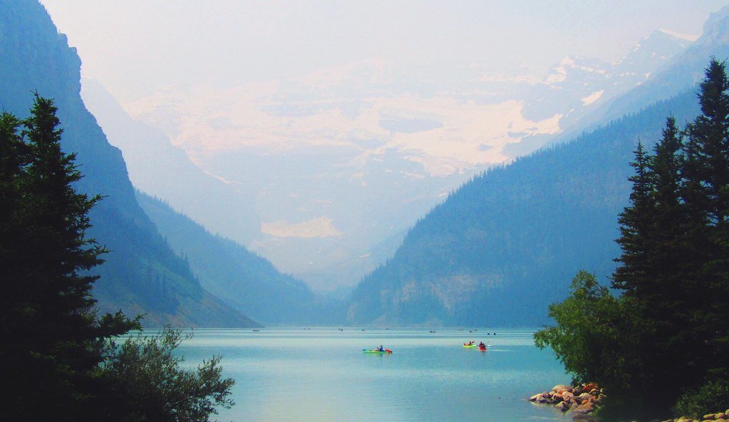 Lake Louise in Banff National Park with mountains reflected in still water