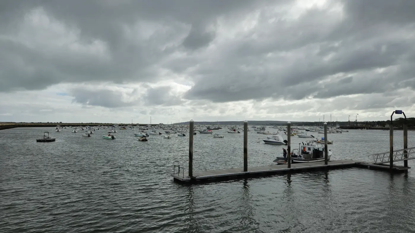Boats moored across Plymouth Harbor in Massachusetts